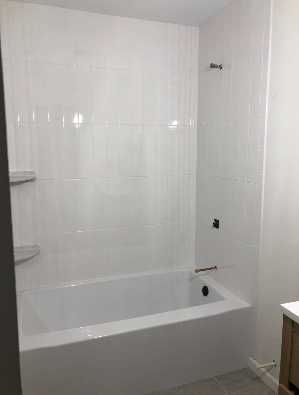 White subway-tiled tub surround